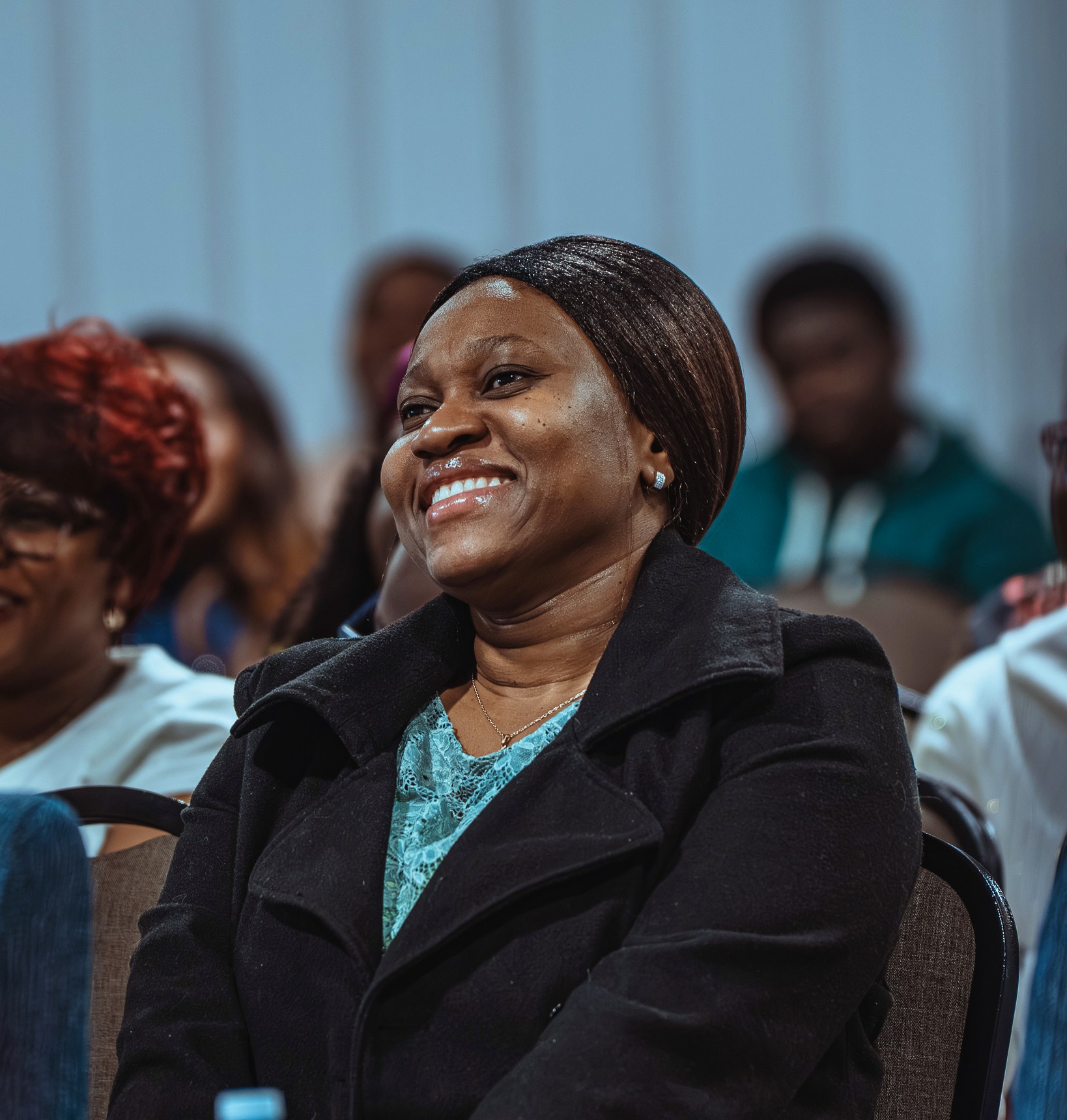 A smiling church member seated at a table