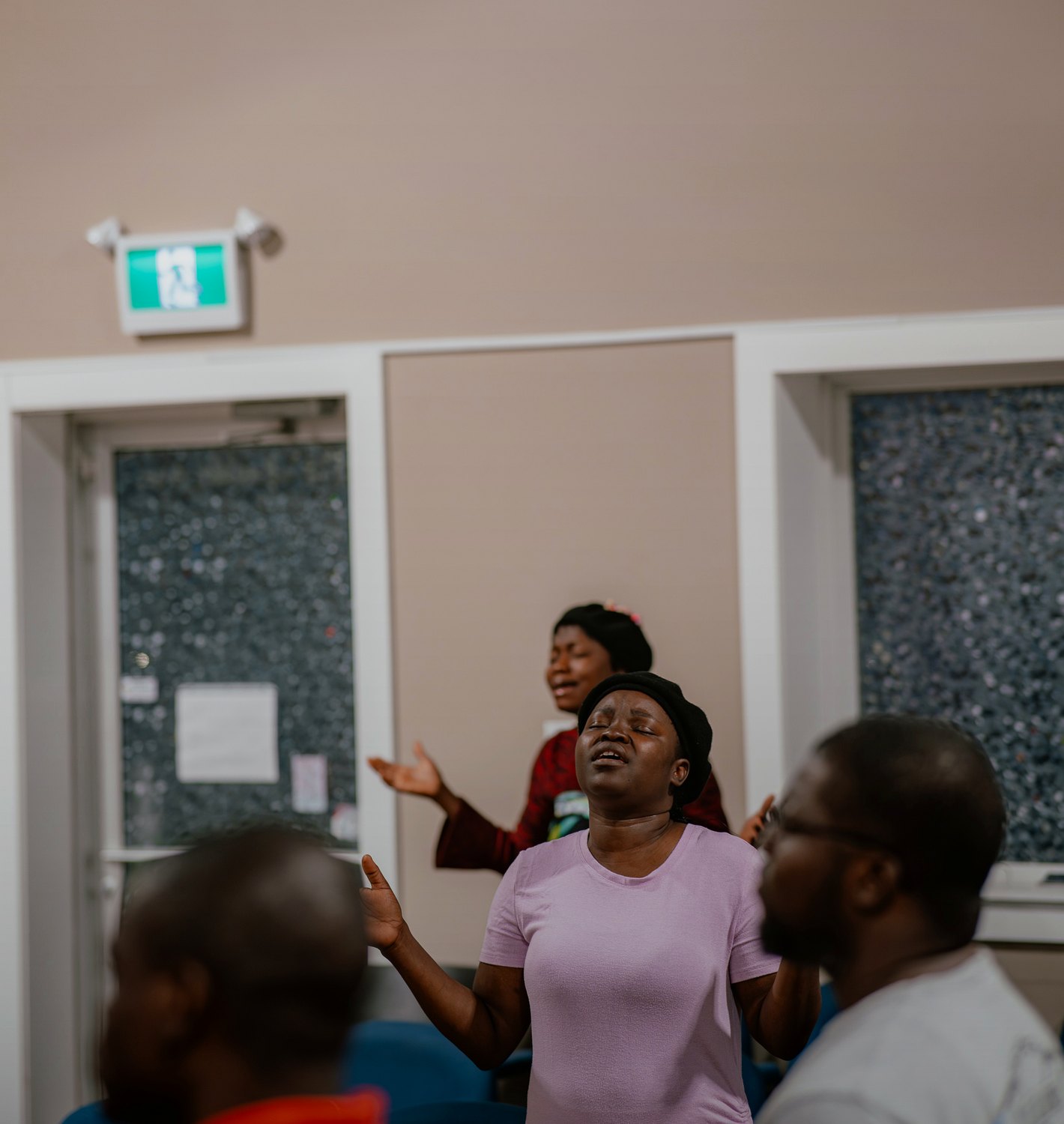 Church members praying together during Destiny Recovery