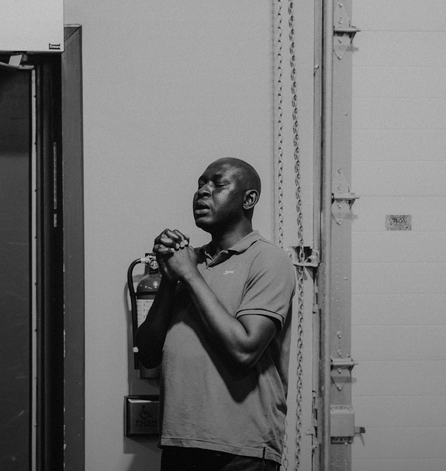 A quiet black and white prayer moment
