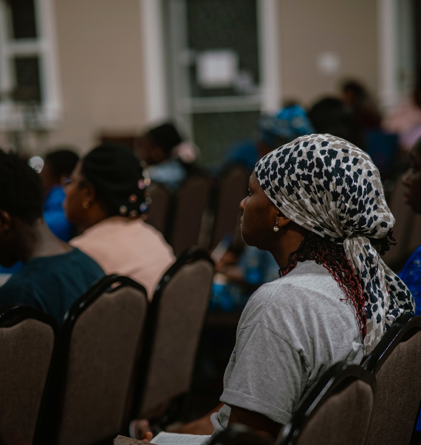 A church member holding a Bible during Destiny Recovery