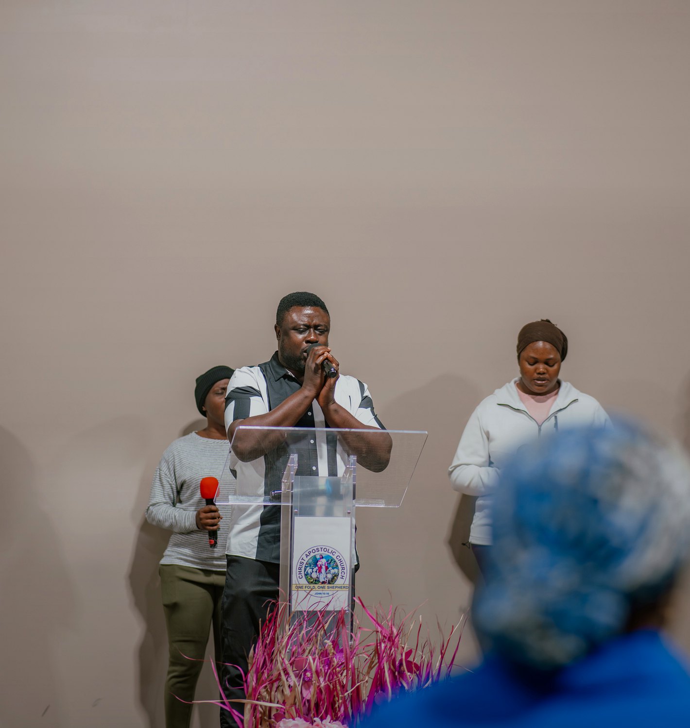 A minister leading prayer at Destiny Recovery