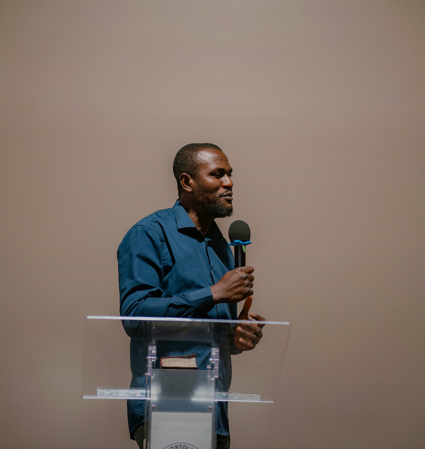 A minister speaking at the pulpit