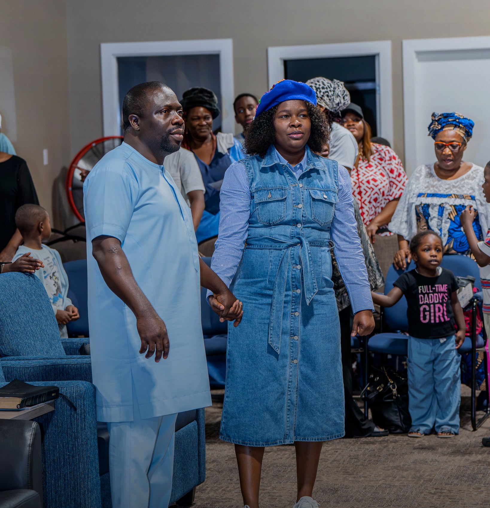 Church members standing together during the gathering