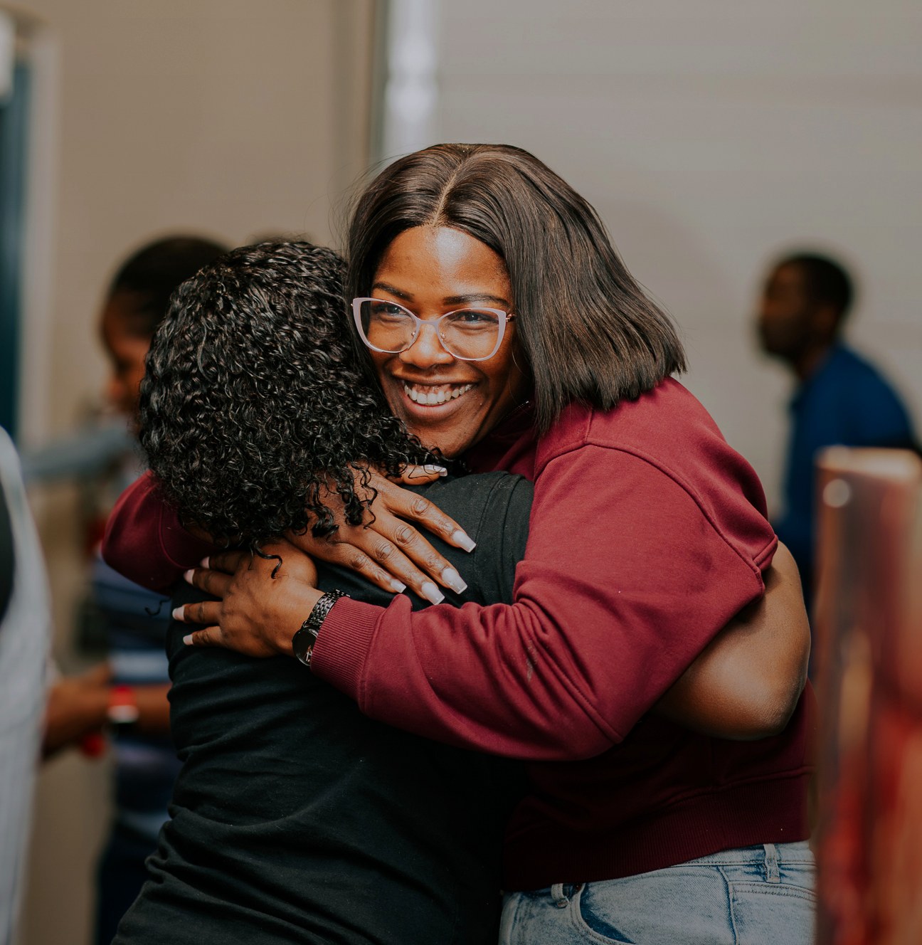 Two church members sharing a warm hug