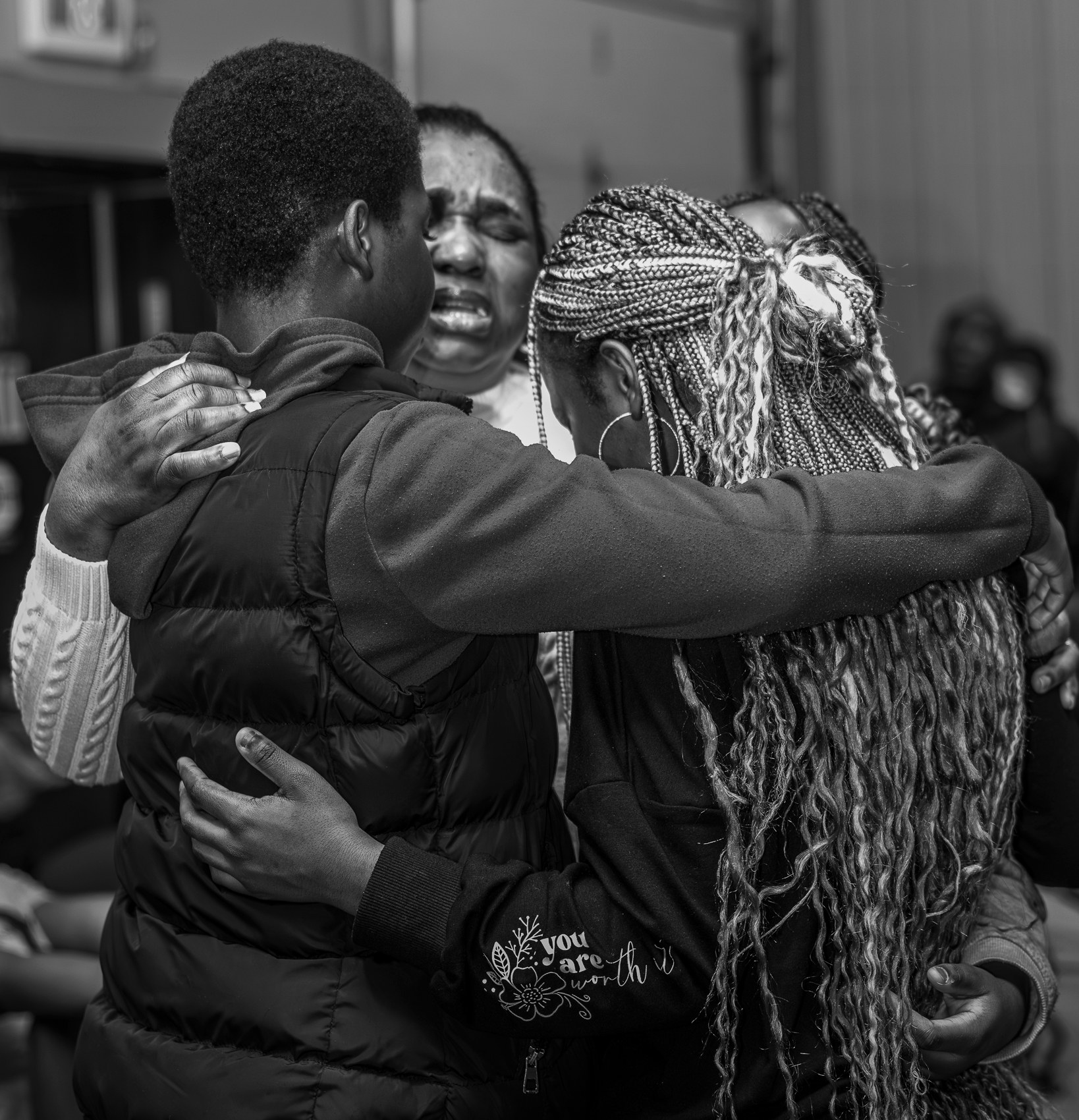 Church members embracing in a group