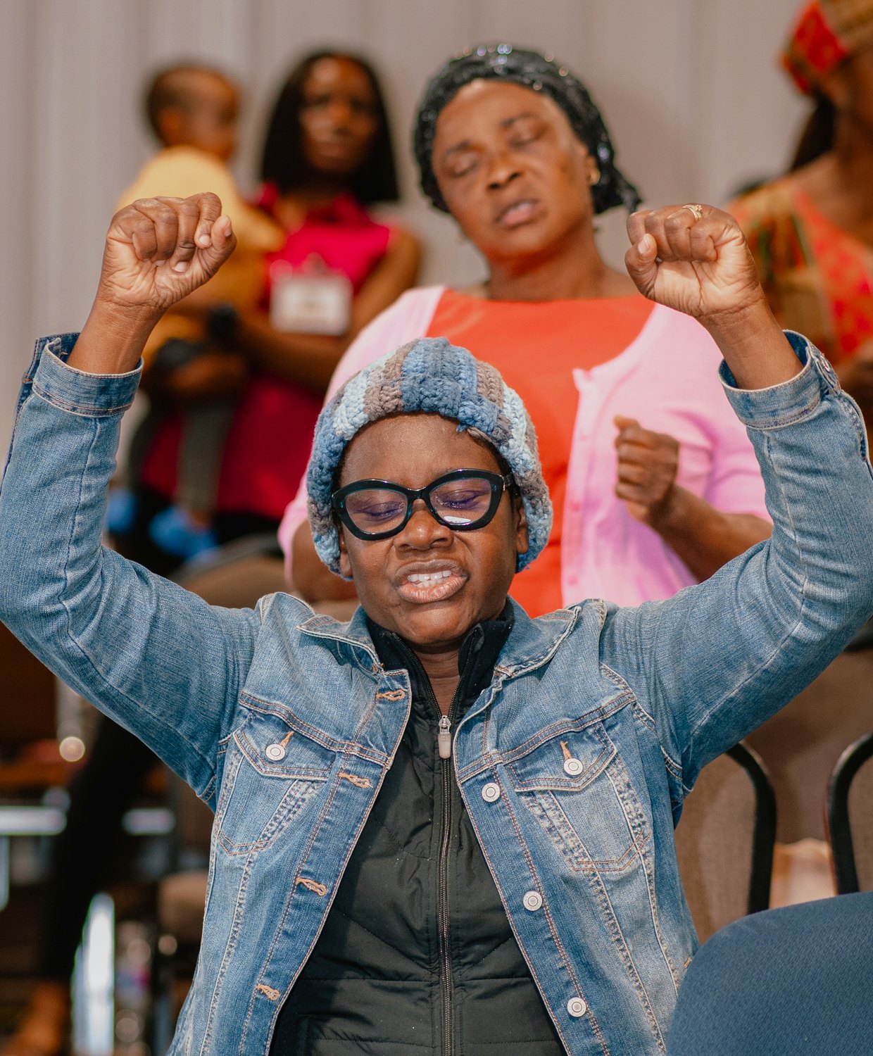 A joyful prayer moment during Solution Hour